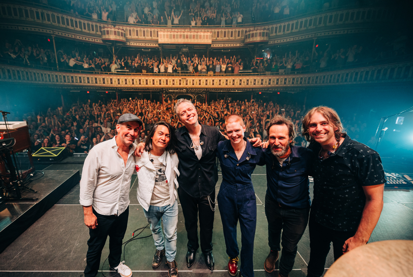 Jason Isbell and the 400 Unit on Stage with crowd behind them